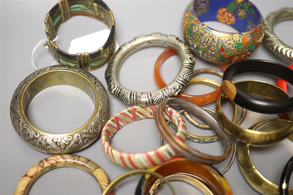 A collection of bangles, including five ethnic white metal examples,